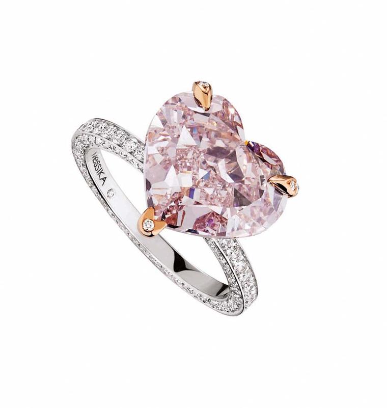 Messika Heart pink diamond engagement ring with rose gold prongs and a diamond pavé band.